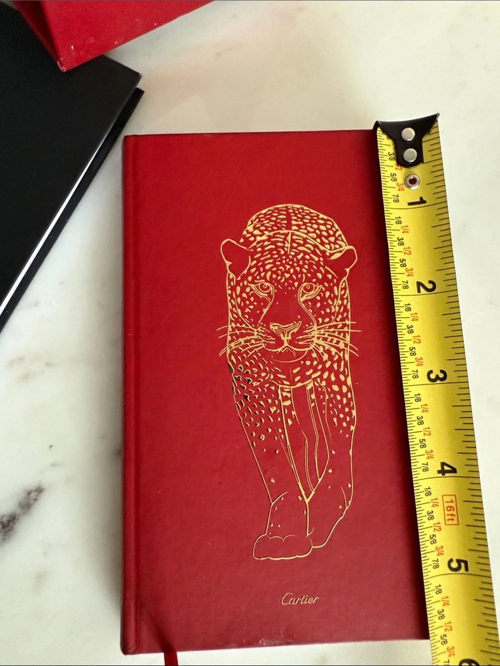 Cartier Red and Black Hardcover Notebooks with Gold Accents
